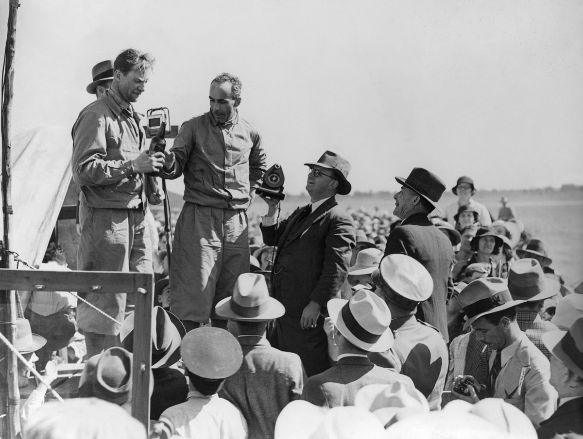  Charles Scott and Tom Campbell Black sharing a cold beverage while speaking to journalists at Charleville (State Library QLD) 