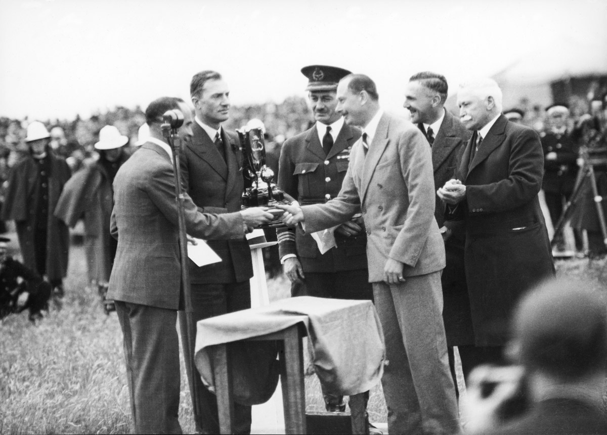  The Duke of Gloucester presents the winners trophy to Scott and Campbell Black at Flemington. Sir McPherson Roberston at right (State Library VIC) 