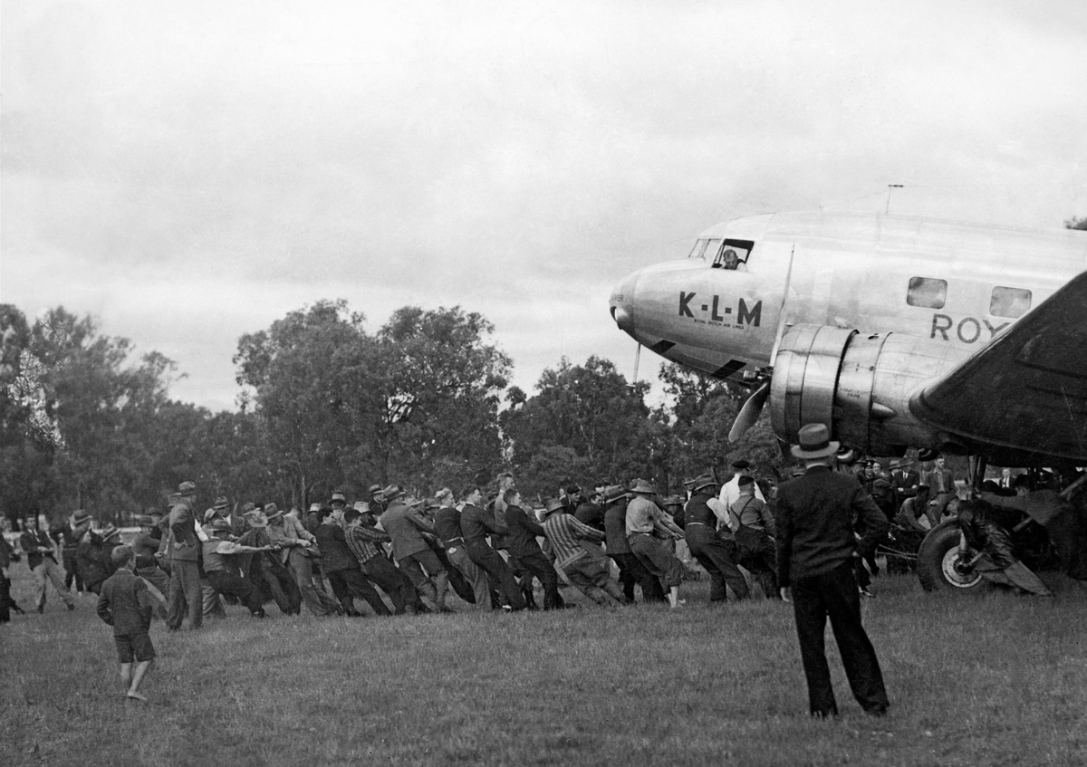  KLM 'Uiver' DC-2 being pulled from the mud at Albury Racecourse. First Officer Jan Moll in foreground 
