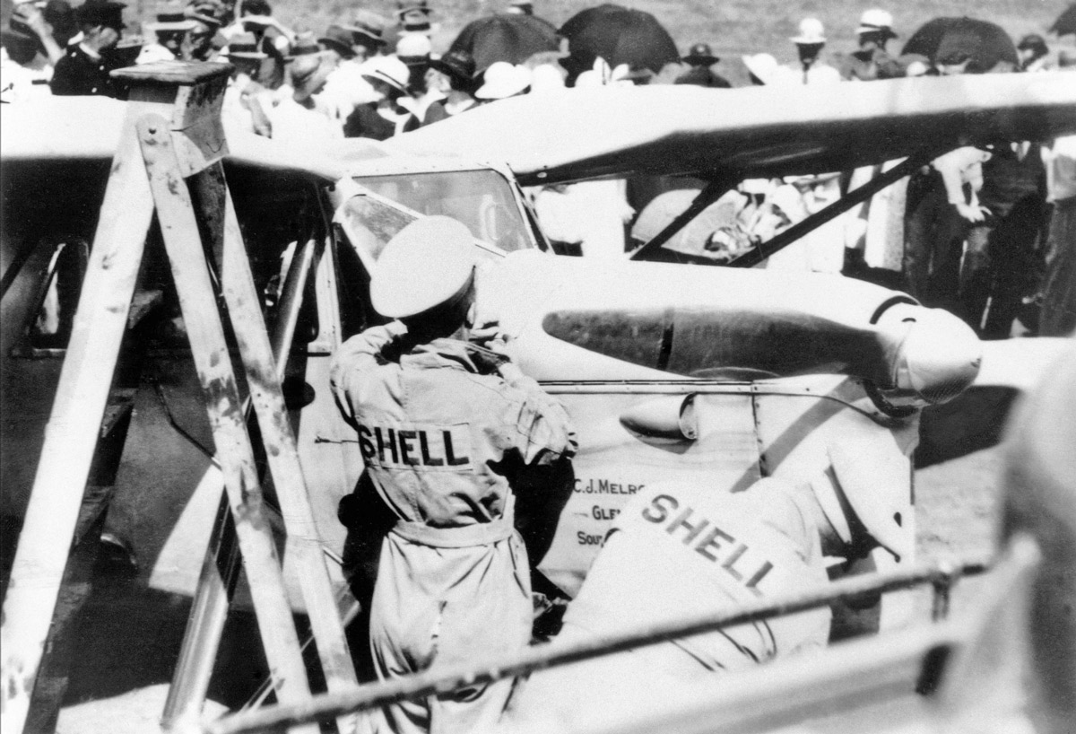  Jimmy Melrose's DH.80 Puss Moth being refueled at Charleville (State Library QLD) 