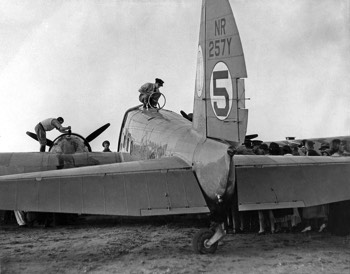  Roscoe Turner working on an engine while Reeder Nichols refuels the Boeing 247D at Charleville (State Library QLD) 