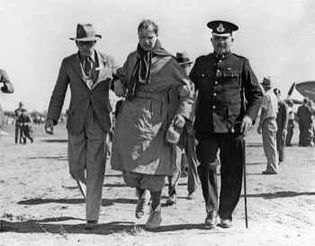  An exhausted Charles Scott being assisted after landing at Charleville, Queensland (State Library QLD) 